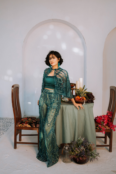 'Green Mosaic Allure' dress by Berry Bosom, captivating with its enigmatic green palette and layered patterns, a stunning addition to the festive collection.