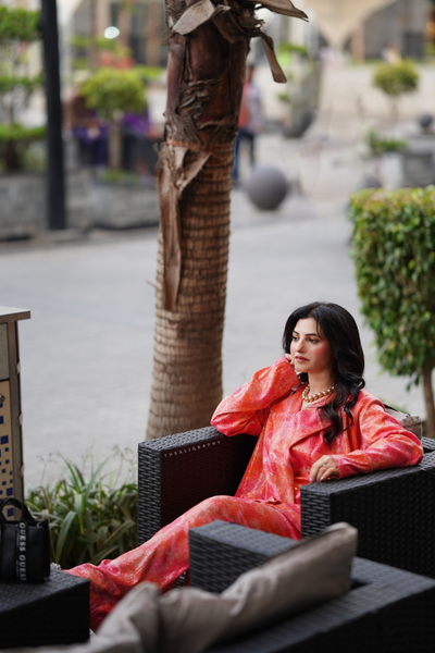 Borealis set - three-piece tie-dye blazer set with tube top and flared pants, vibrant orange and pink outfit, casual and chic women's fashion set, retro-inspired high-waist flared pants.