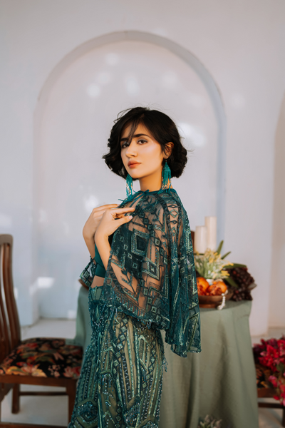 'Green Mosaic Allure' dress by Berry Bosom, captivating with its enigmatic green palette and layered patterns, a stunning addition to the festive collection.